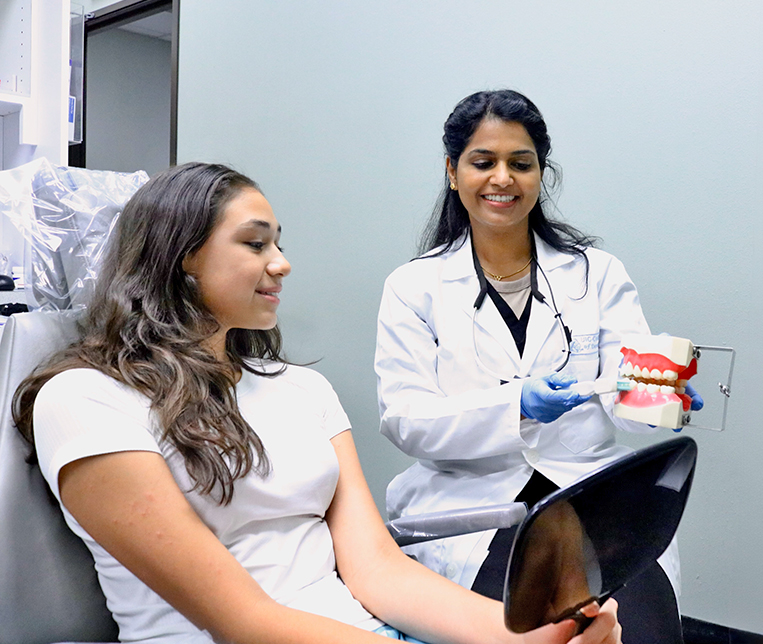 Dr. Sajini Chandran with a patient.